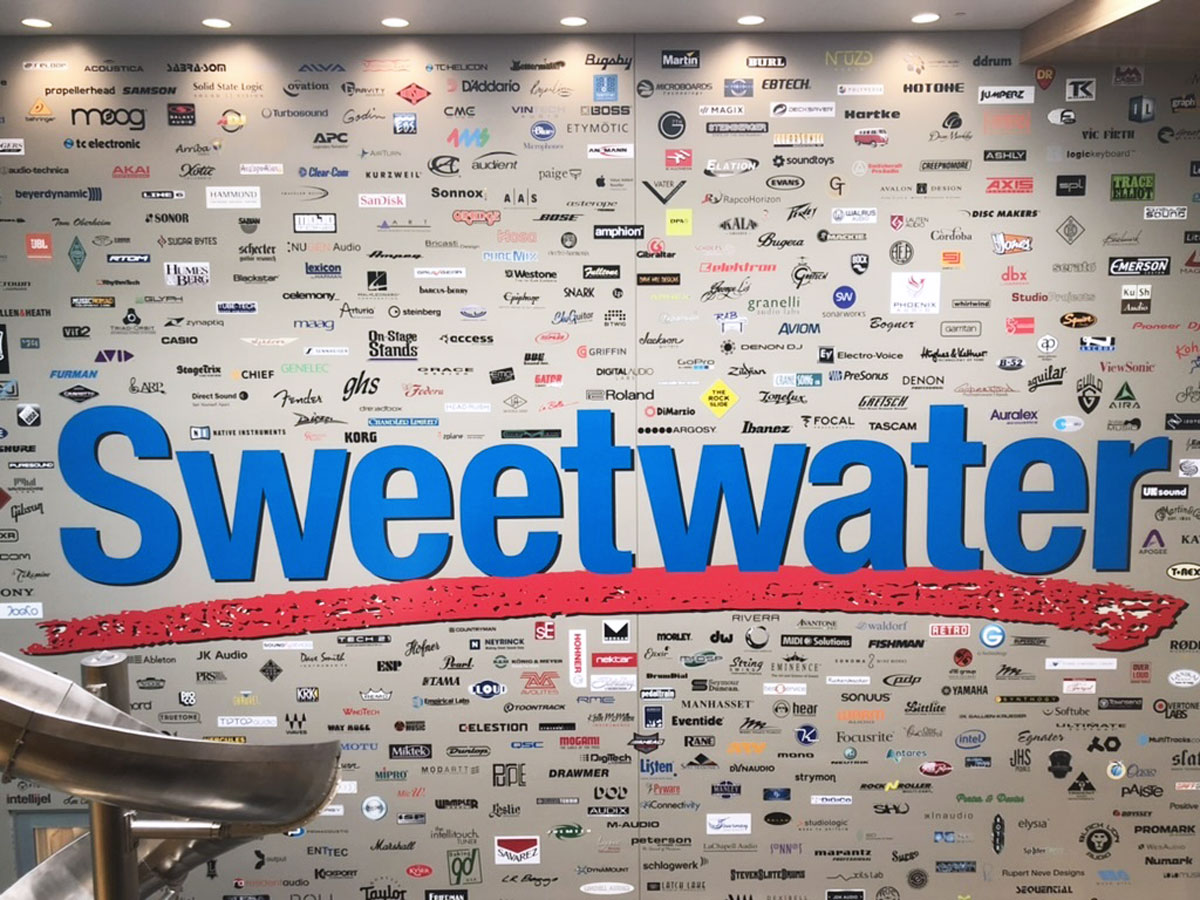 A picture of a wall with hundreds of tiny logos at Sweetwater