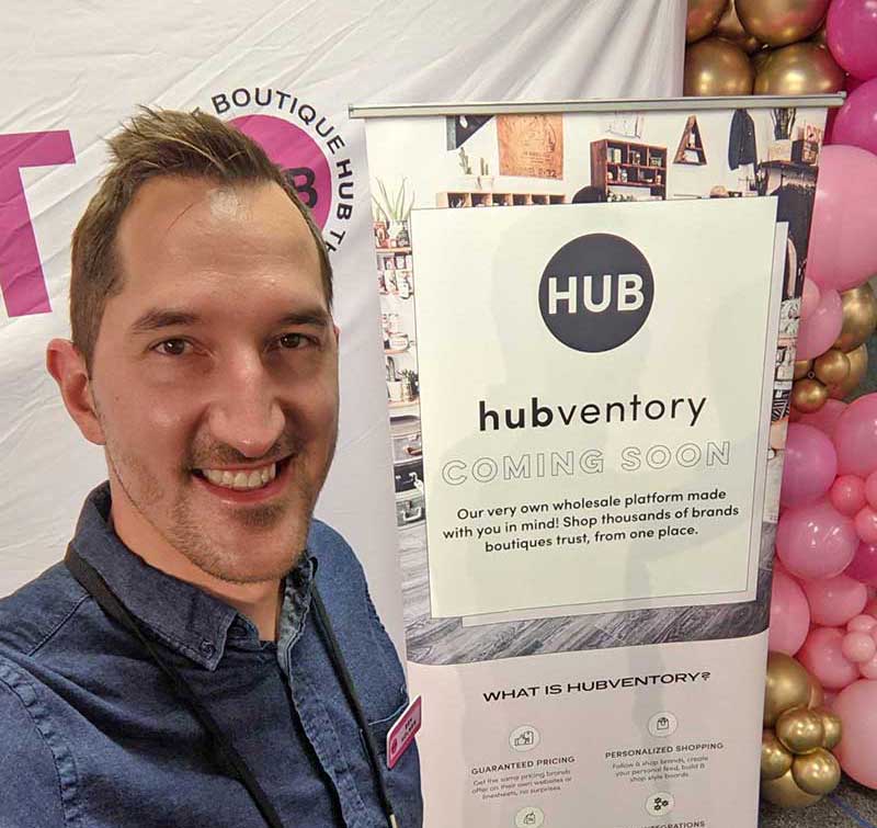 A photo of Ben Holmen, the CTO of The Boutique Hub, at a conference.