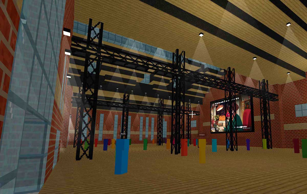 Cinematic interior view of the Voxacon venue showing the stage and audience area.
